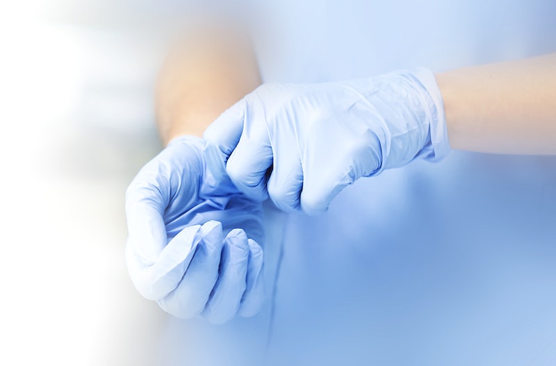 Wearing gloves to prevent the spread of coronavirus